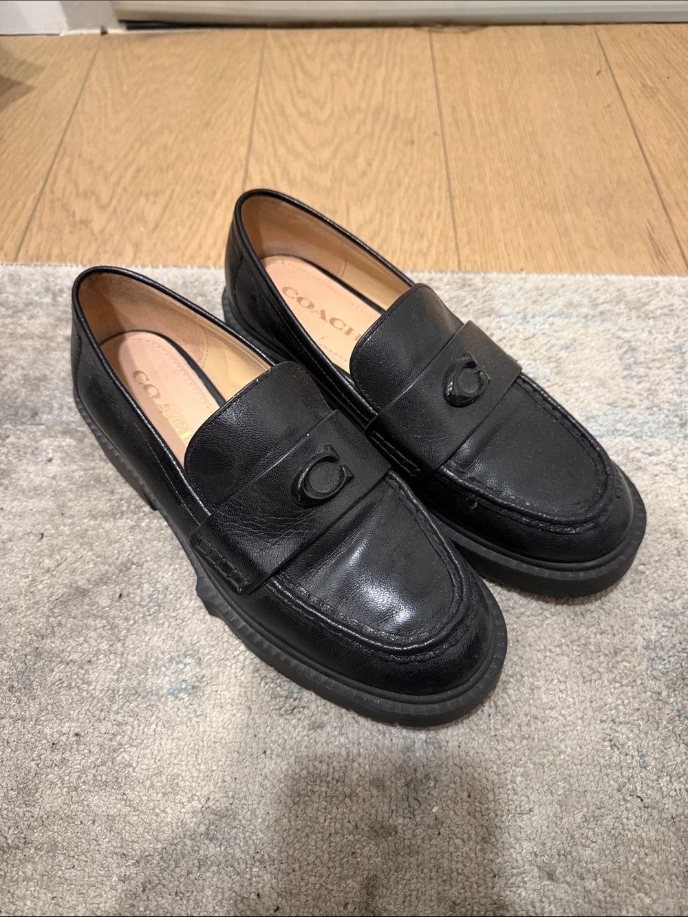 Coach Black Leather Penny Loafers with Signature 'C' Accent